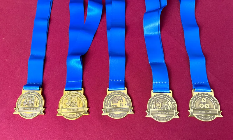 Five MTBA medals on blue ribbons, one for each tournament: Unmarked 3-D, Marked 3-D, Field, Target 900 and Indoor 450